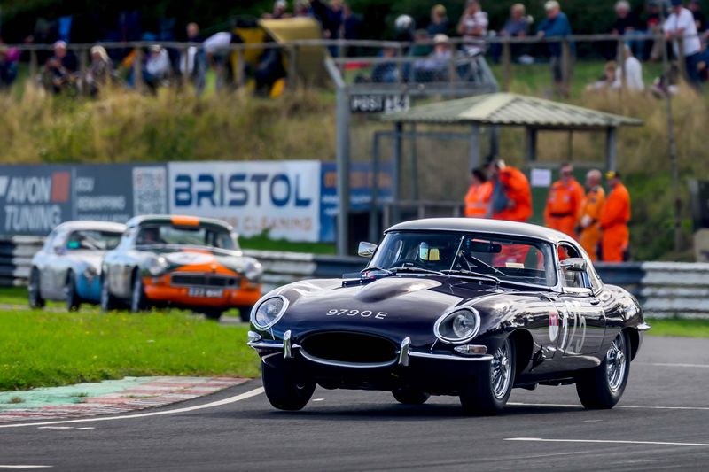 Hilton & Moss take the purple E-Type to Castle Combe