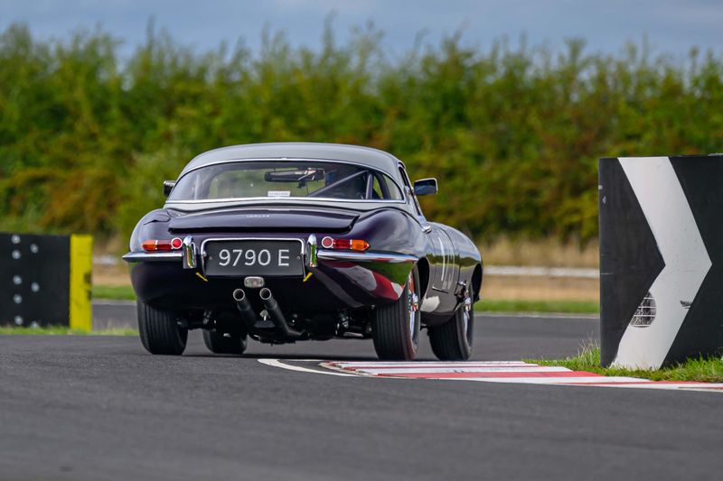 Hilton & Moss take the purple E-Type to Castle Combe