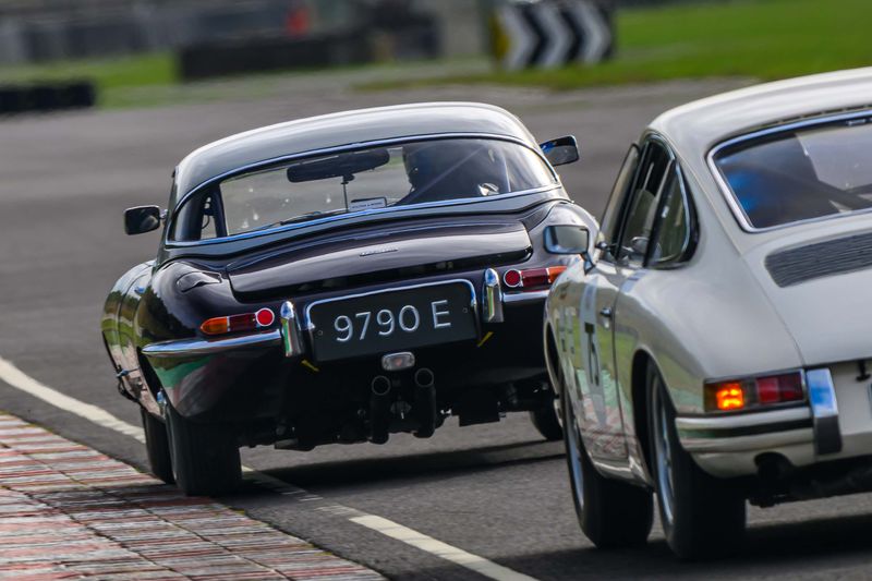 Hilton & Moss take the purple E-Type to Castle Combe