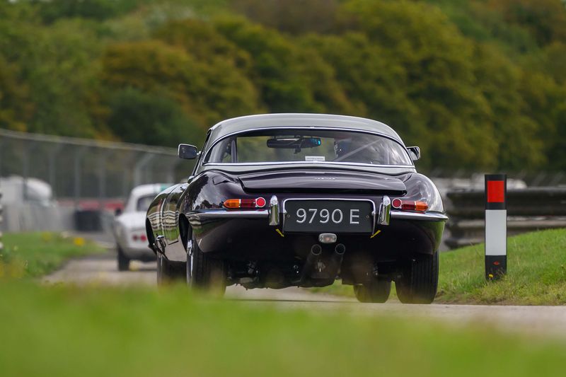 Hilton & Moss take the purple E-Type to Castle Combe